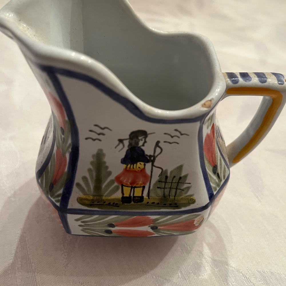 Quimper France Hand-Painted Ceramic Pitcher with a small cuts on rim as shown